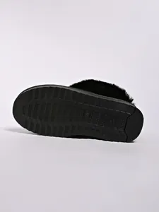 Bottom view of women's warm snow boots with anti-slip sole and faux fur trim