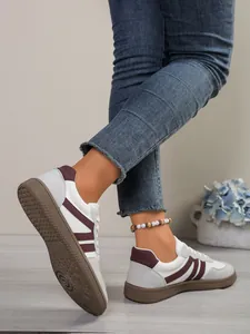 Detail view of women's colorblock GAT sneakers with anti-slip textured rubber soles