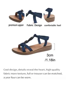 Detail view of navy blue flat sandals featuring elastic back strap and 3cm soft heel