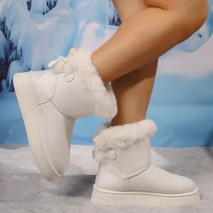 Side view of women's white faux fur snow boots with bow accent and platform sole