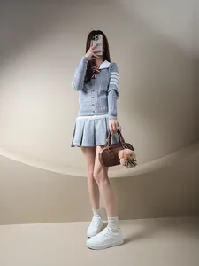 Chic women's white platform sneakers with minimalist round toe design for casual street style
