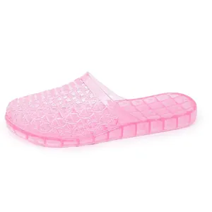 Detailed view of pink glittery hollow-out jelly slippers with breathable mesh design