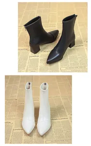 Detailansicht der spitzen Damen-Stiefeletten mit Blockabsatz in Schwarz und Weiß