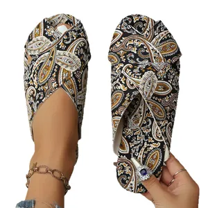Ethnic paisley print flat slide sandals for women featuring crossover toe strap design