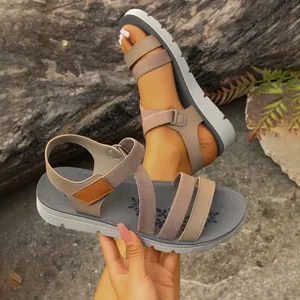 Detailed view of women's retro criss-cross strap flat sandals with elastic bands