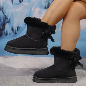 Stylish black plush-lined snow boots featuring cute bow details and thick platform soles.