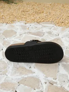 Detailed macro view of non-slip sole texture on platform mules for women