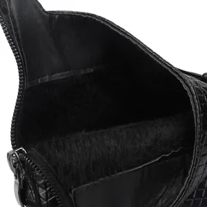 Macro view of warm black faux fur interior and metal zipper on fashion ankle boots