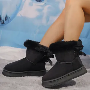 Black winter snow boots with plush faux fur trim and bow detail