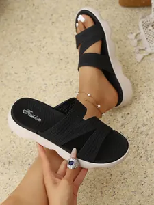 Detail view of comfortable black flyknit platform slides with non-slip footbed for women