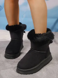 Classic black women's snow boots with plush faux fur trim and thick platform soles