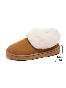 Detail showing 3cm sole height of warm chestnut snow boots with white faux fur trim.