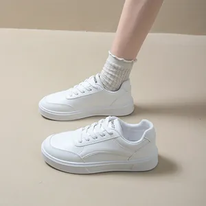 Minimalist women's white casual sneakers with thick platform soles and classic round toe