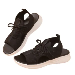 Women's plus size sports sandals with thick white soles and black fly-knit uppers