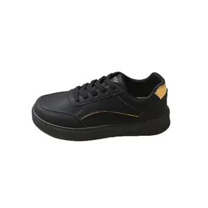 Minimalist black platform sneakers for women with gold accents and round toe