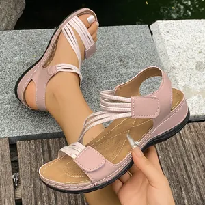 Stylish and comfortable pink women's sporty flat sandals with adjustable velcro straps