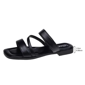 Side view of elegant black flat sandals featuring a 0.98-inch heel and square toe design