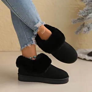 Black women's warm snow boots with faux fur collar and flat anti-slip rubber sole.