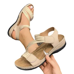 Comfortable women's sporty flat sandals with beige elastic straps and velcro