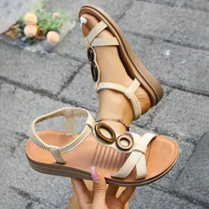 Elegant beige women's flat sandals with retro wooden rings and elastic straps outdoor