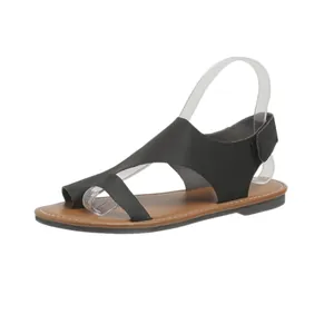 Sandali romani piatti neri minimalisti da donna con passante per l'alluce e velcro
