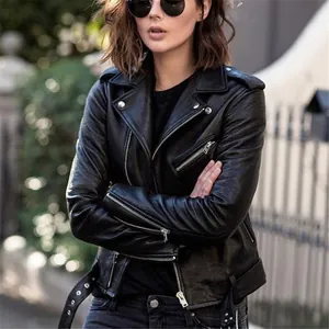 Close-up of a women's black PU leather motorcycle jacket in a street style view.