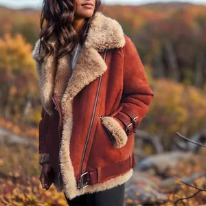 Close-up of a women's brown suede shearling jacket featuring thick wool lining and buckle details