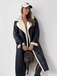 Stylish women's black faux leather long coat featuring soft white shearling lining and collar