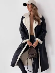 Stylish women's oversized winter long coat with reversible lapels and faux shearling lining