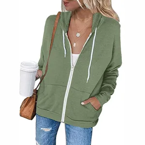 Stylish sage green zip-up hoodie for women with white drawstrings and cozy front pockets
