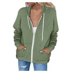 Detailed view of green women's zip-up hoodie with hood, drawstrings, and front pockets