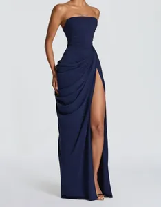 Close-up of navy blue strapless maxi dress with high slit and draped details