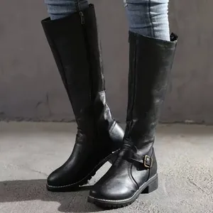 Black knee-high knight boots with side zipper and buckle detail on low chunky heel.