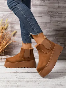 Brown suede platform snow boots with warm lining and elastic side panels
