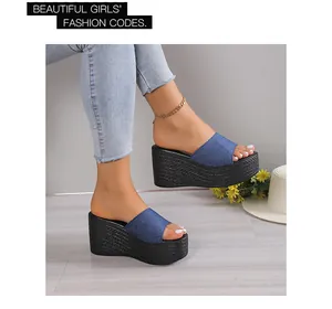 Women's denim wedge slide sandals with thick black platform and straw texture
