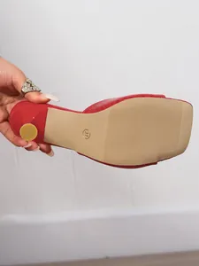 Detailed view of red stone-patterned square toe mule showing the sole and size 37 mark.