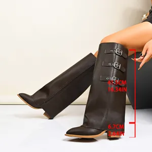 Detailed view of brown pant-leg boots with 41.5cm shaft height and 6.7cm heel measurements