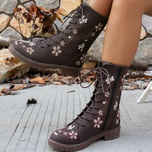 Women's brown mid-calf boots with floral embroidery and lace-up front