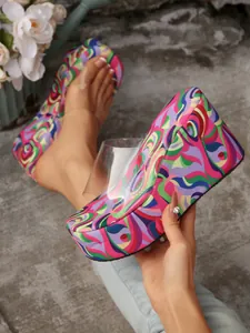 Detail of colorful psychedelic pattern wedge slippers with transparent strap