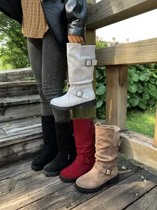 Detail of slouchy mid-calf western boots with buckle and knit collar in multiple colors