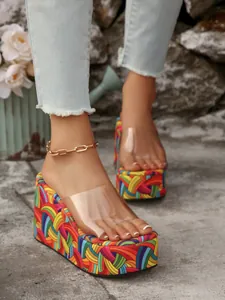Detailed view of colorful rainbow platform wedge sandals with transparent PVC strap