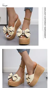 Close-up of beige bow wedge sandals with straw-textured platform soles