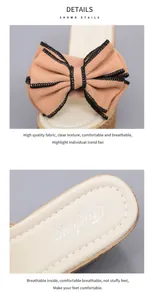 Detailed view of women's bow wedge slippers showing high-quality fabric and breathable insole