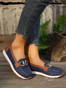 Women's denim blue platform loafers with stylish metal chain and brown leather trim