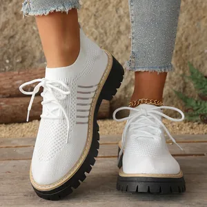 Stylish white knit lace-up sneakers with thick black soles for comfortable daily wear