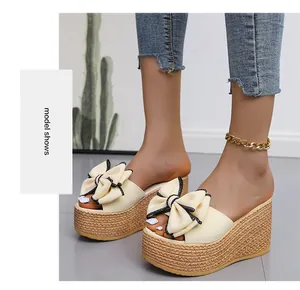Elegant cream bow wedge platform slippers with decorative braided rope sole detail