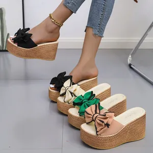 Fashionable summer platform wedge slippers for women with large bow knot and straw texture