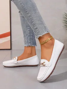 Casual white leather loafers for women featuring elegant gold metal bit buckle