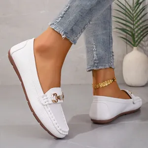 Elegant white women's loafers with soft sole and gold metal buckle detail