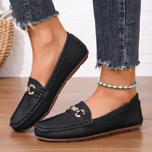 Women's black leather loafers with metal buckle and soft flat sole for casual wear